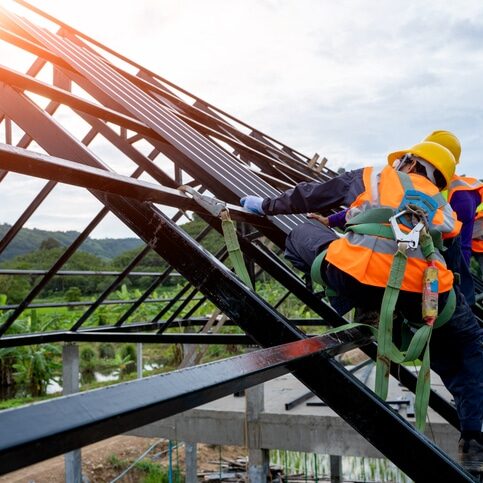 Roofer worker in protective uniform wear and gloves